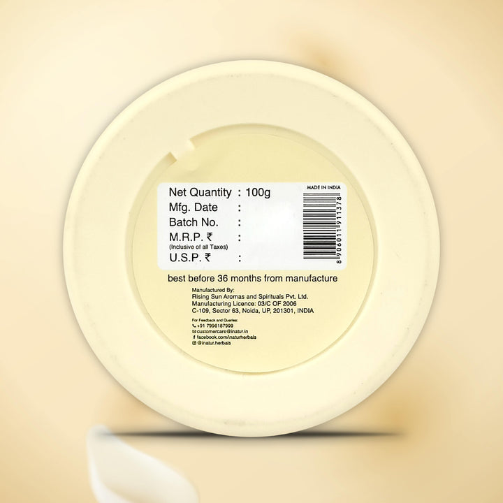 Back label of inatur kumkumadi face pack on a beige background