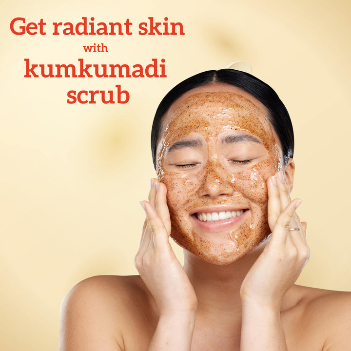 A beautiful Model applying kumkumadi scrub to their face with a beige background and text Get Radiant Skin