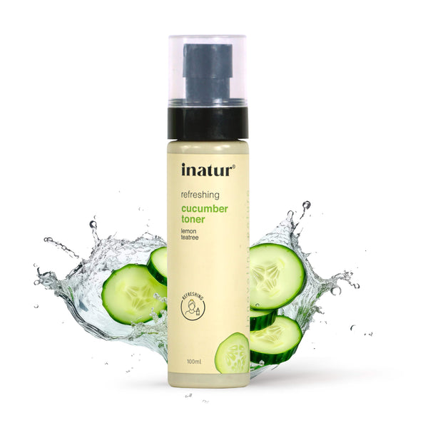 inatur refreshing cucumber toner bottle with sliced cucumbers and water splash on a white background