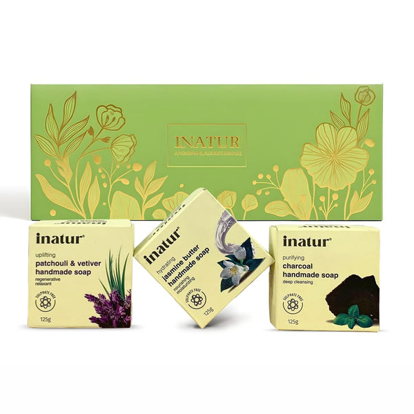 INATUR soap packaging with three different soaps on a white background with a gift box