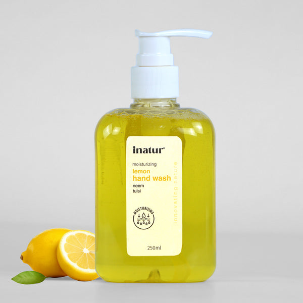 inatur Lemon Hand Wash bottle with a pump dispenser with lemons and leaves in the background.