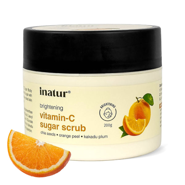 Jar of inatur vitamin-C sugar scrub with orange slices on a white background
